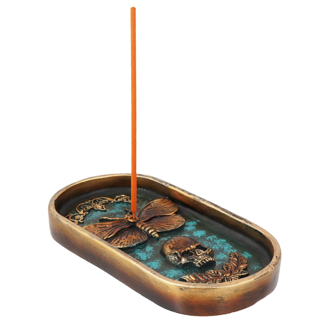 Moth and skull burner shown with incense