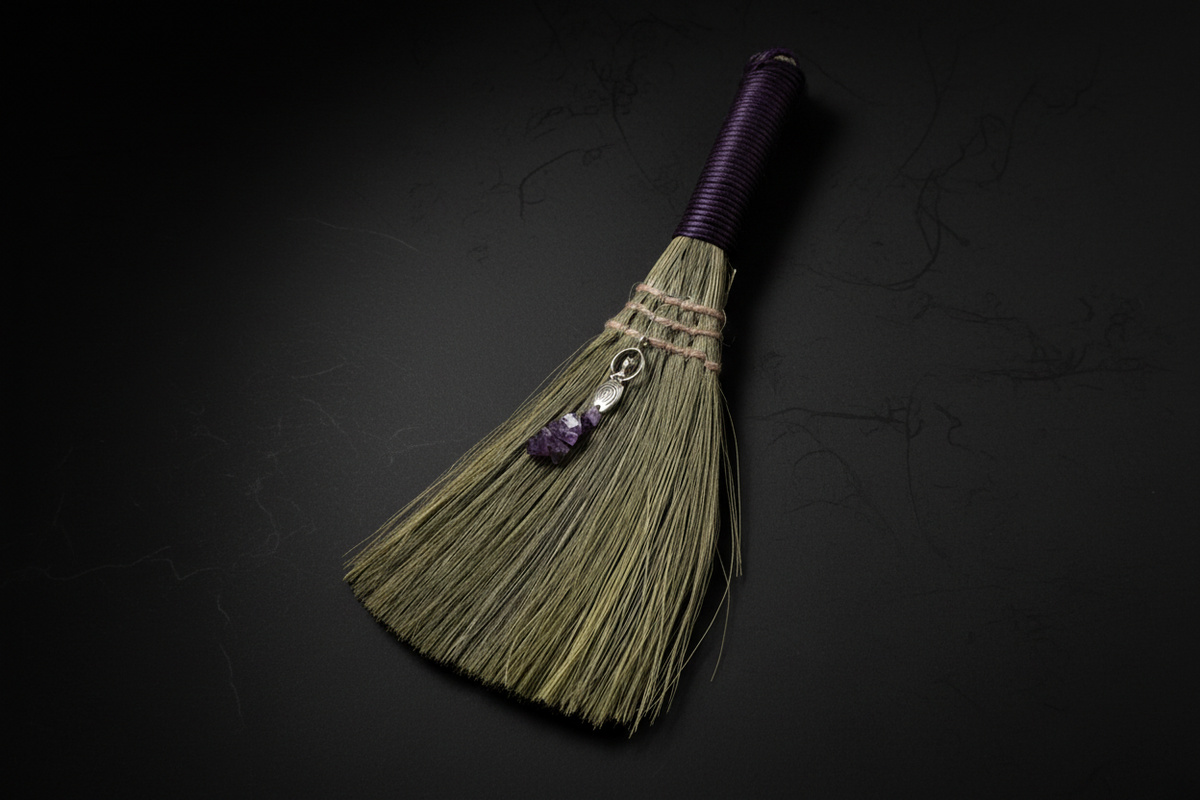 woman holding an altar broom