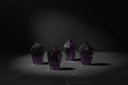 Polished dark-purple amethyst diamond obelisk with a faceted point