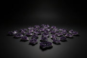 Assorted raw amethyst druzy clusters with purple quartz crystal points