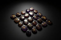 Amethyst rune set arranged with matching casting board