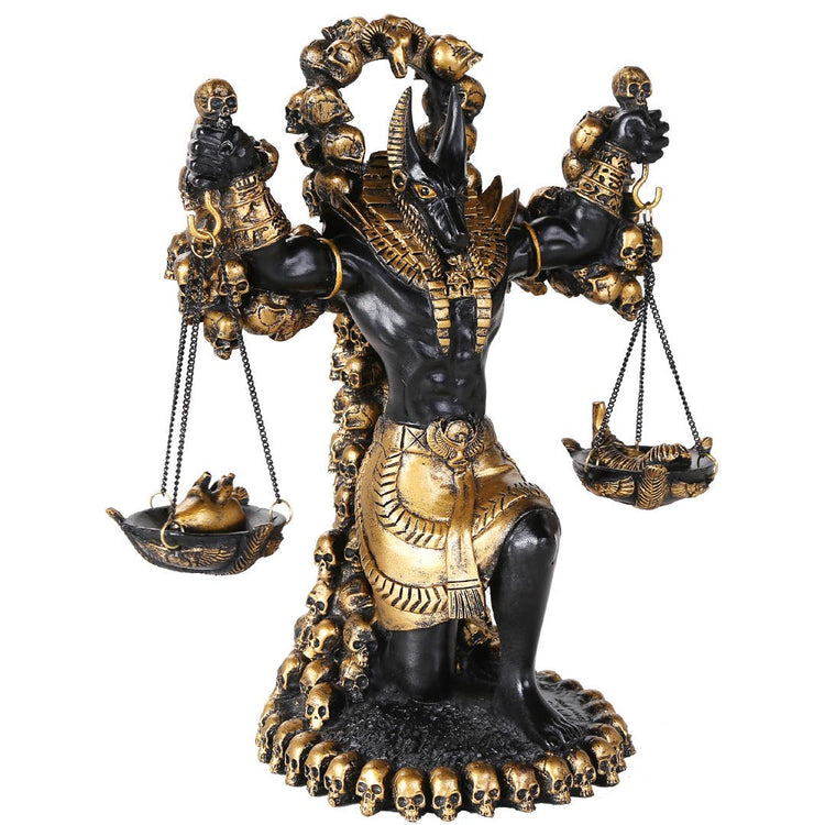 Statue of a deity with scales and skulls on a white background