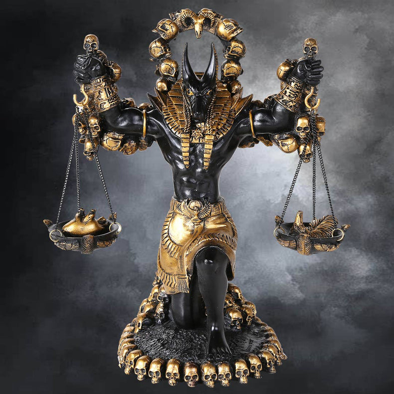 Statue of a deity with scales and skulls on a dark background