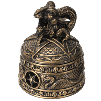 Decorative bronze bell with ram's head on a transparent background