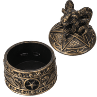 Bronze-colored decorative item with ram head design on a white background