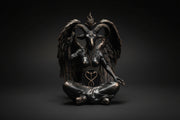 Bronze statue of a winged creature with a heart symbol on a white background