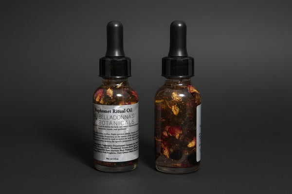 A bottle with Baphomet Ritual Oil on a dark background.