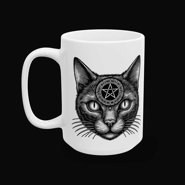 a white mug with a black cat on it on a black background.