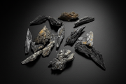 Raw dark bladed specimen sold as black kyanite with a natural wing-like form