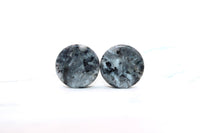 Round stone earrings on a white background