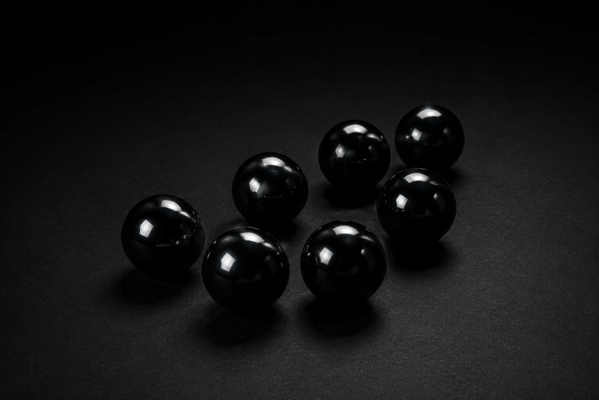 Assortment of glossy black Obsidian spheres in multiple sizes