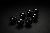 Representative assortment of glossy black spheres sold as Obsidian; volcanic-glass identity, treatment, selected 30 mm, 40 mm, or 120 mm size, polish, and exact condition vary