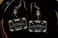 ouija board earrings black background