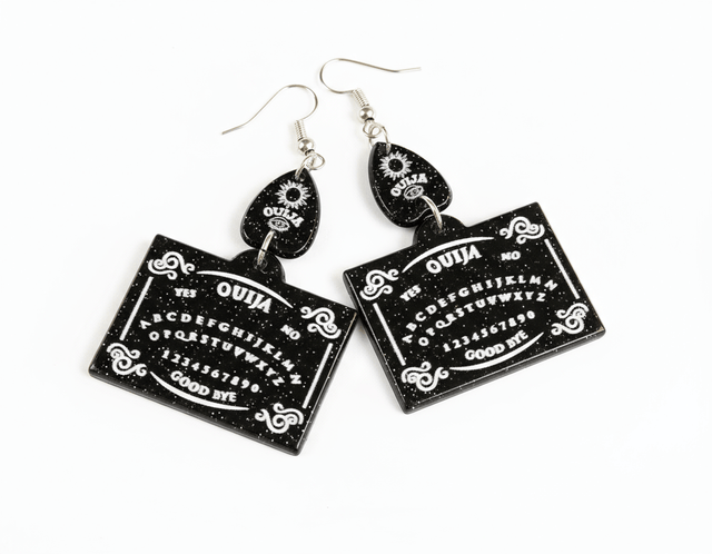 Black and white Ouija board earrings on a white background