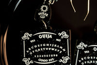 closeup of ouija board earrings