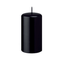 Black candle on a white background