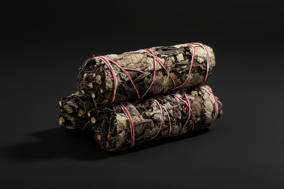 Black Sage smoke cleansing herbal bundles tied with red string