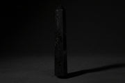 Double-terminated black tourmaline wand held in hand
