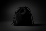 Black velvet drawstring pouch on a white background