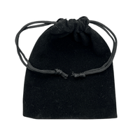 Black velvet drawstring pouch on a white background