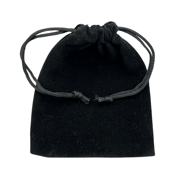 Black velvet drawstring pouch on a white background