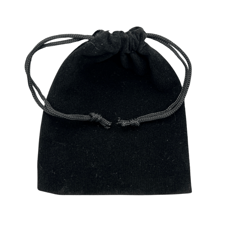 Black velvet drawstring pouch on a white background
