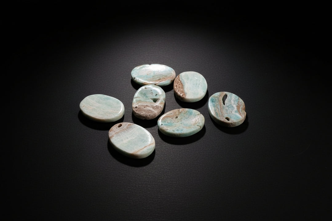 Polished pale-blue to blue-green Aragonite worry stone