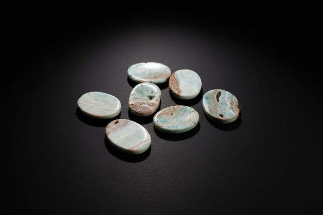 Polished pale-blue to blue-green Aragonite worry stone