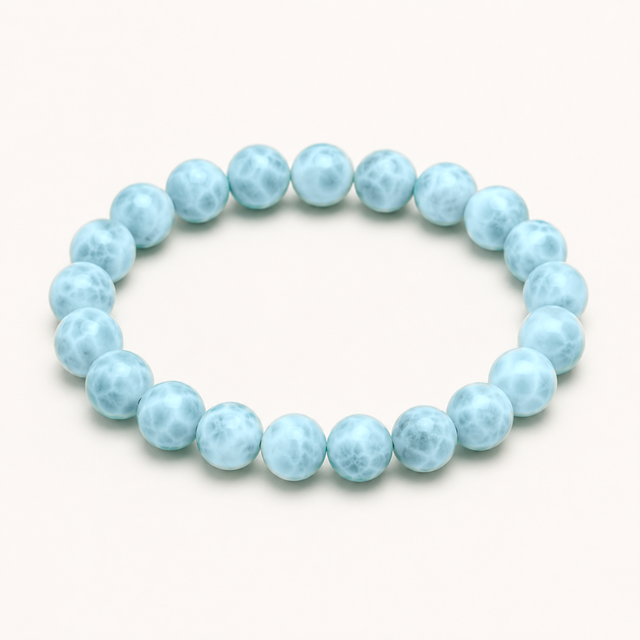 Polished round blue chalcedony beaded stretch bracelet with gentle translucent blue variation.