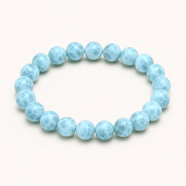 Representative stretch bracelet sold as Blue Chalcedony with polished pale-blue translucent beads; color, clouding, treatment, bead size, and fit vary