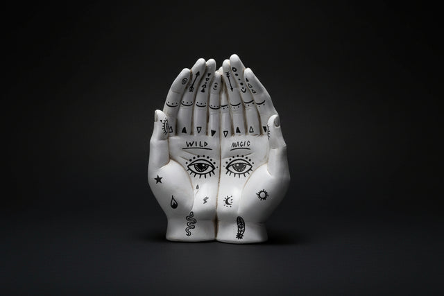 Palmistry hands tray made of cold cast resin with symbolic markings used as a ritual catch dish for altar items.