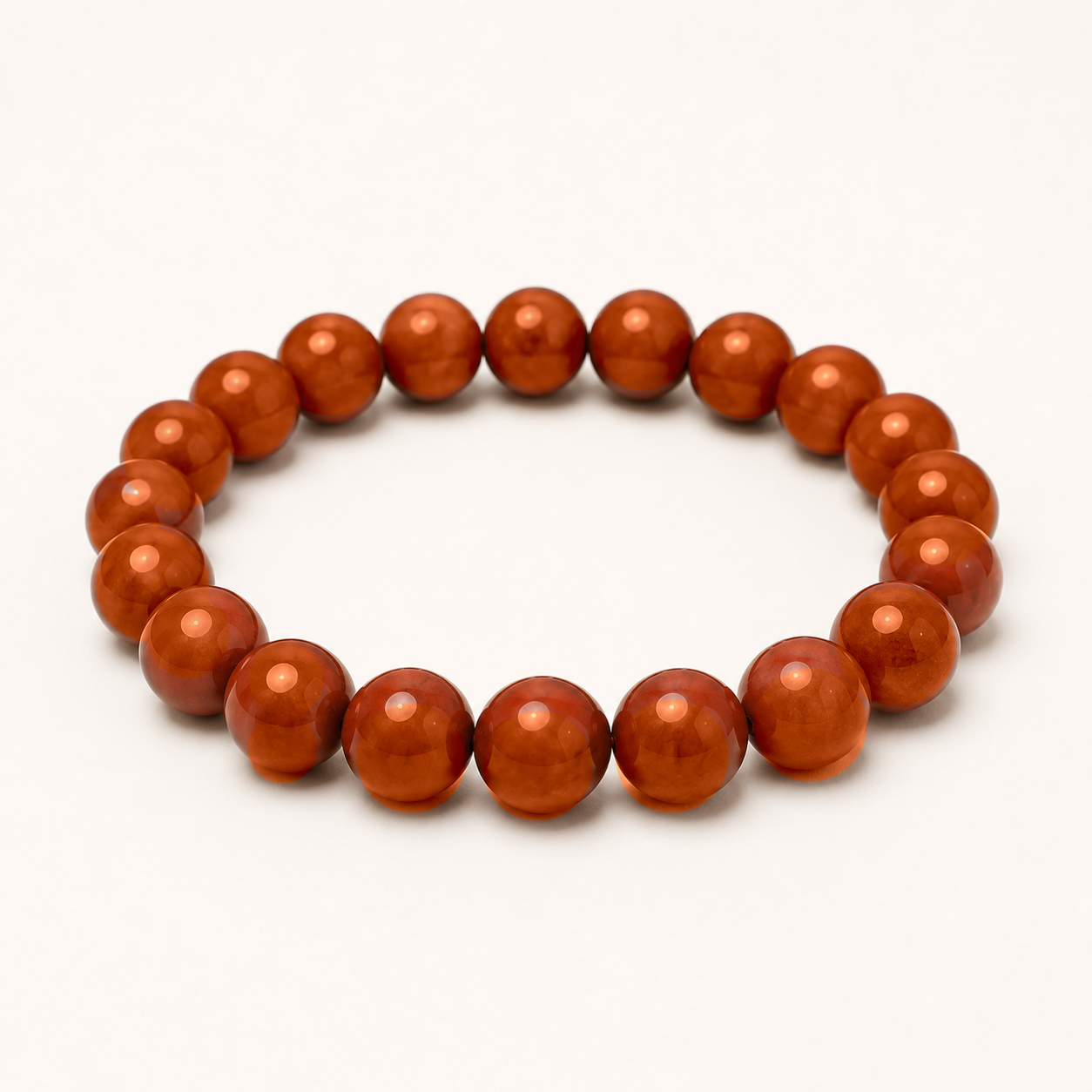 Carnelian beaded stretch bracelet with orange to reddish-brown translucent beads