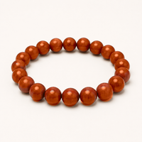 Carnelian beaded stretch bracelet with orange to reddish-brown translucent beads