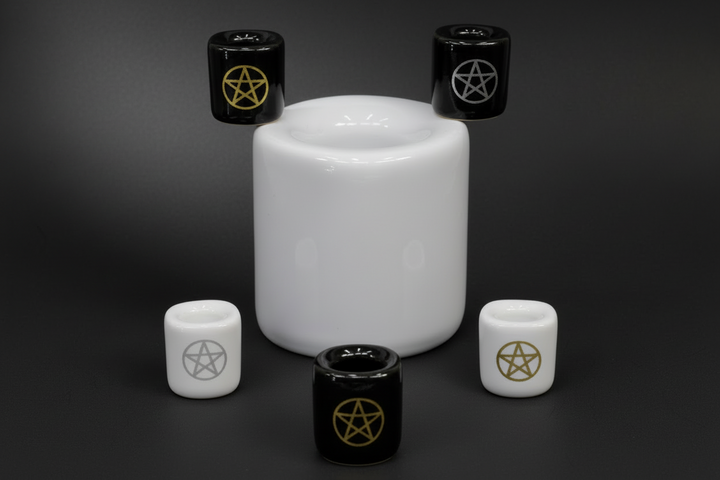 a selection of chime candle holders, some plain some with pentacles