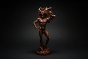 Brown figurine of a muscular man with horns on a white background