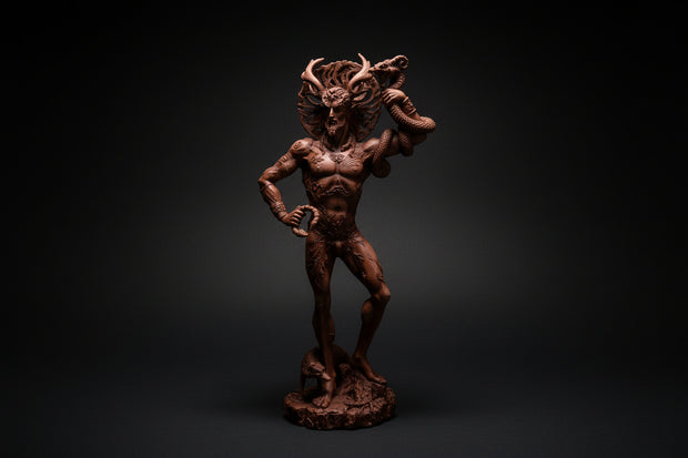 Brown figurine of a muscular man with horns on a white background