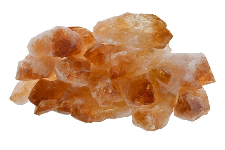 Cluster of citrine points orange crystals on a white background