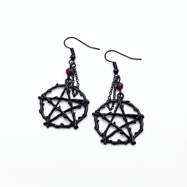 Black pentagram earrings with red gemstones on a white background