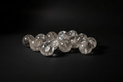 Polished Clear Quartz sphere with natural internal inclusions