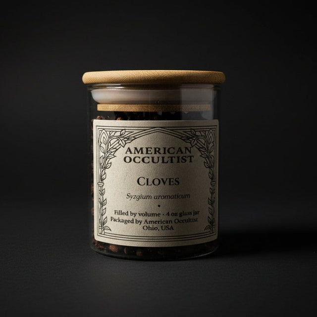 Organic whole cloves (Syzygium aromaticum) in a labeled glass ritual herb jar