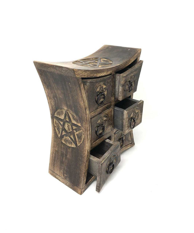 Wooden dresser with pentagram designs on a white background