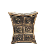 Wooden stool with star patterns on a white background