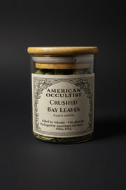 Organic cut-and-crushed bay leaves (Laurus nobilis) in a labeled glass ritual herb jar
