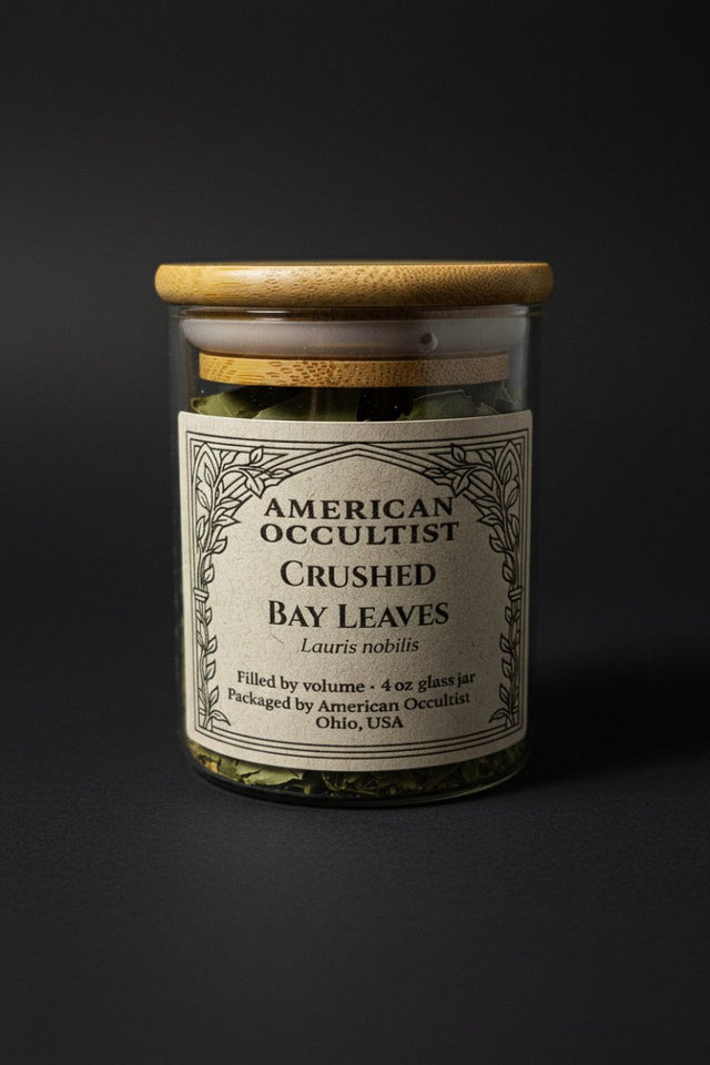 Organic cut-and-crushed bay leaves (Laurus nobilis) in a labeled glass ritual herb jar