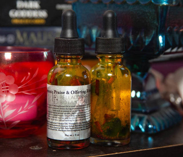 Two dropper bottles with labels on a table with a blurred background