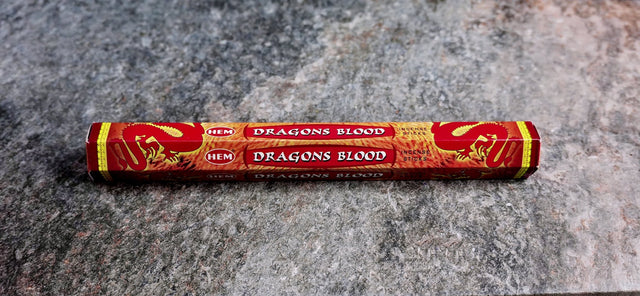 A pack of Dragon's Blood incense sticks with red and gold packaging, labeled for rituals and aromatherapy.