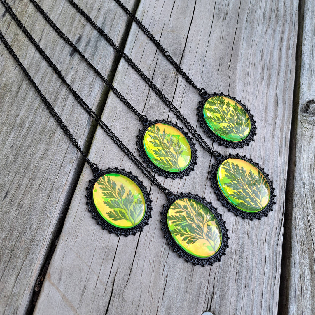 Green holographic pressed fern necklace front view