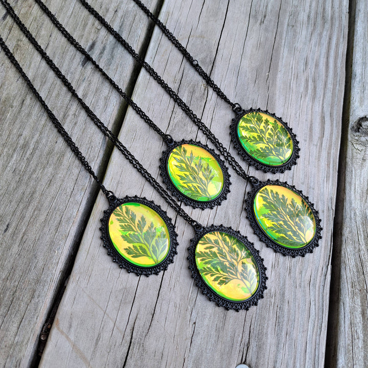 Green holographic pressed fern necklace front view