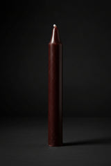 Brown chime candle on a plain background