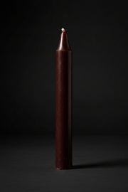 Brown chime candle on a plain background